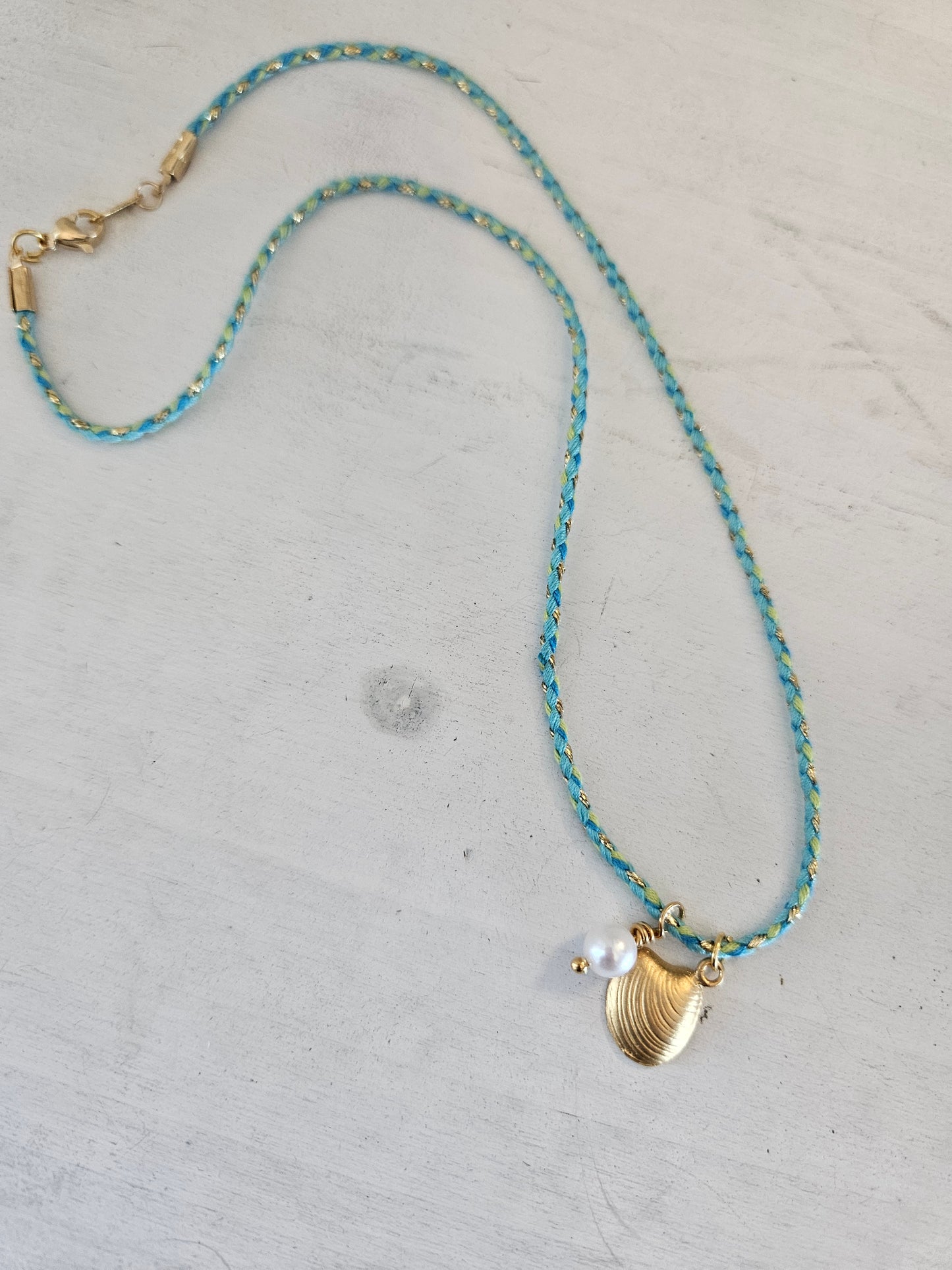 Seashell on aqua cord necklace
